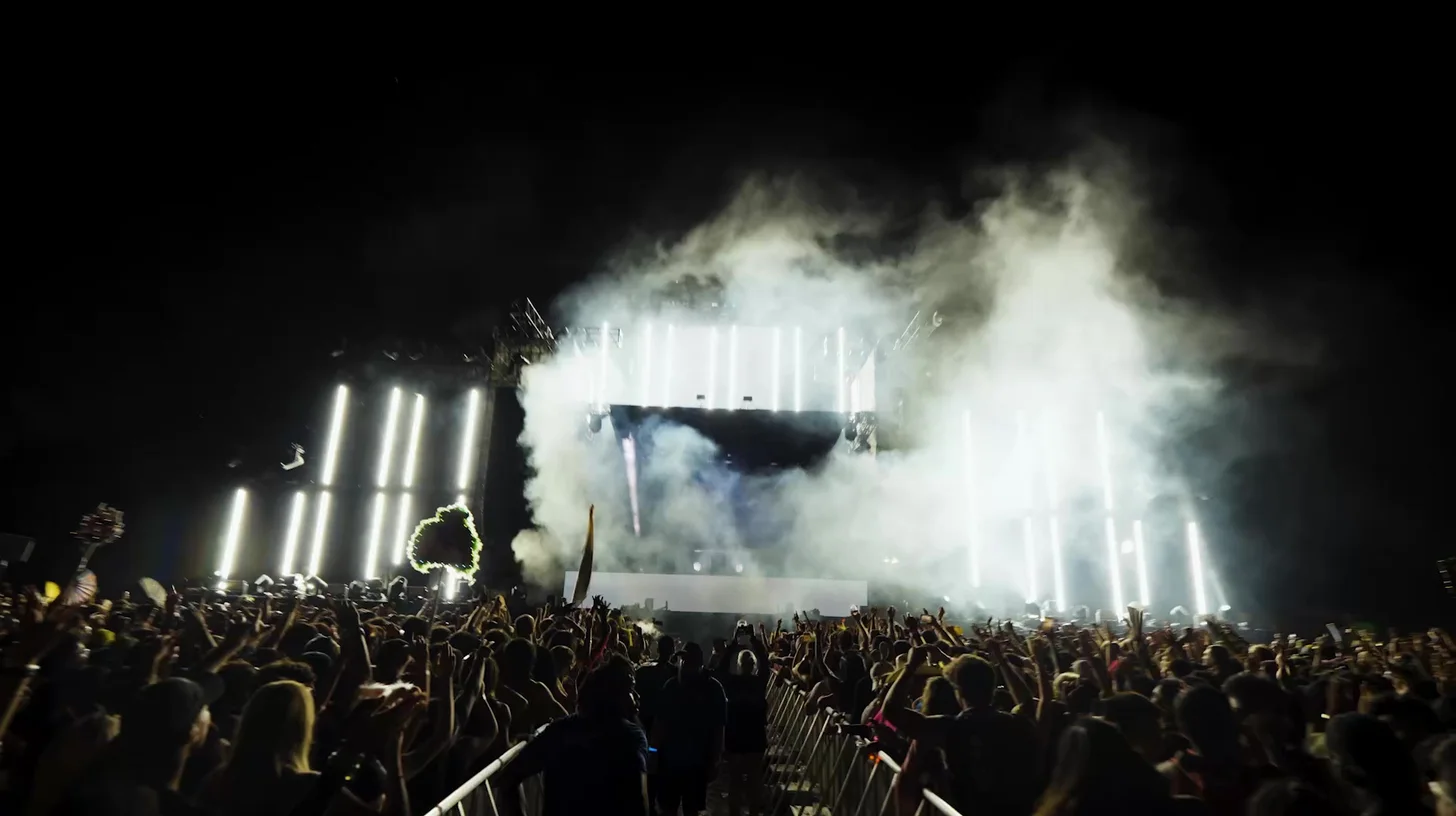 Festival main stage under lights and haze